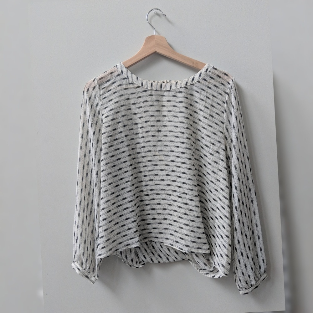 Black and White Flowing Top with Geometric Pattern